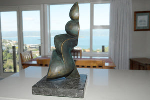 Cello in dining room - Bronze sculpture by Stephen Williams