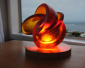 Abstract geometric cast glass sculpture of the atom for sale by Stephen Williams.