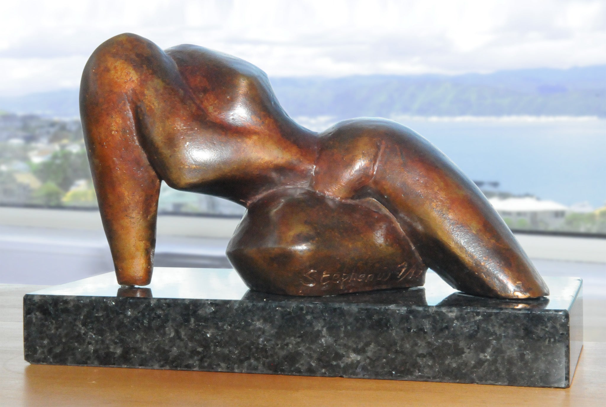 Reclining abstract figurative bronze sculpture by Stephen Williams | New Zealand.