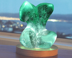 Abstract female figurative cast glass sculpture with light by Stephen Williams.